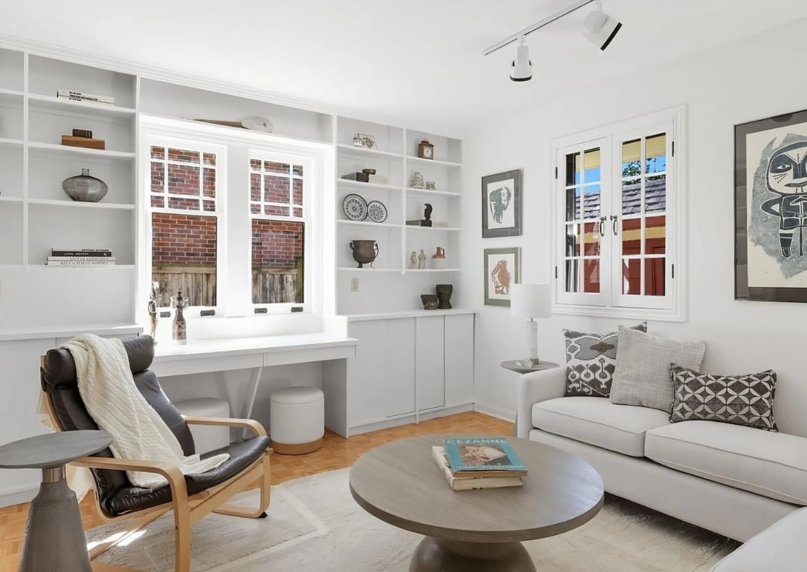 White built-in shelving and desk