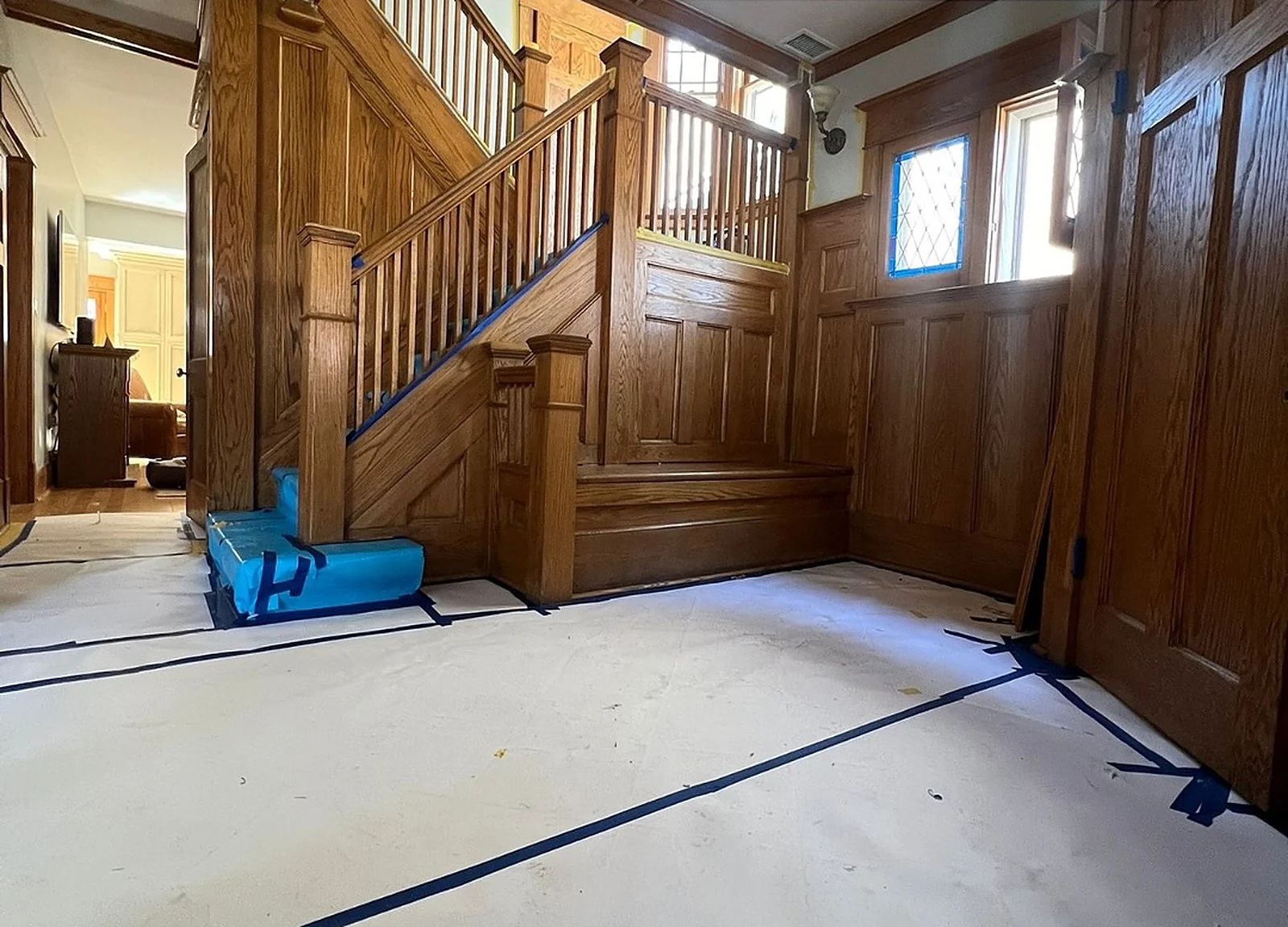 BEFORE: Yonge & Eglinton foyer with dark oak staircase and panelling