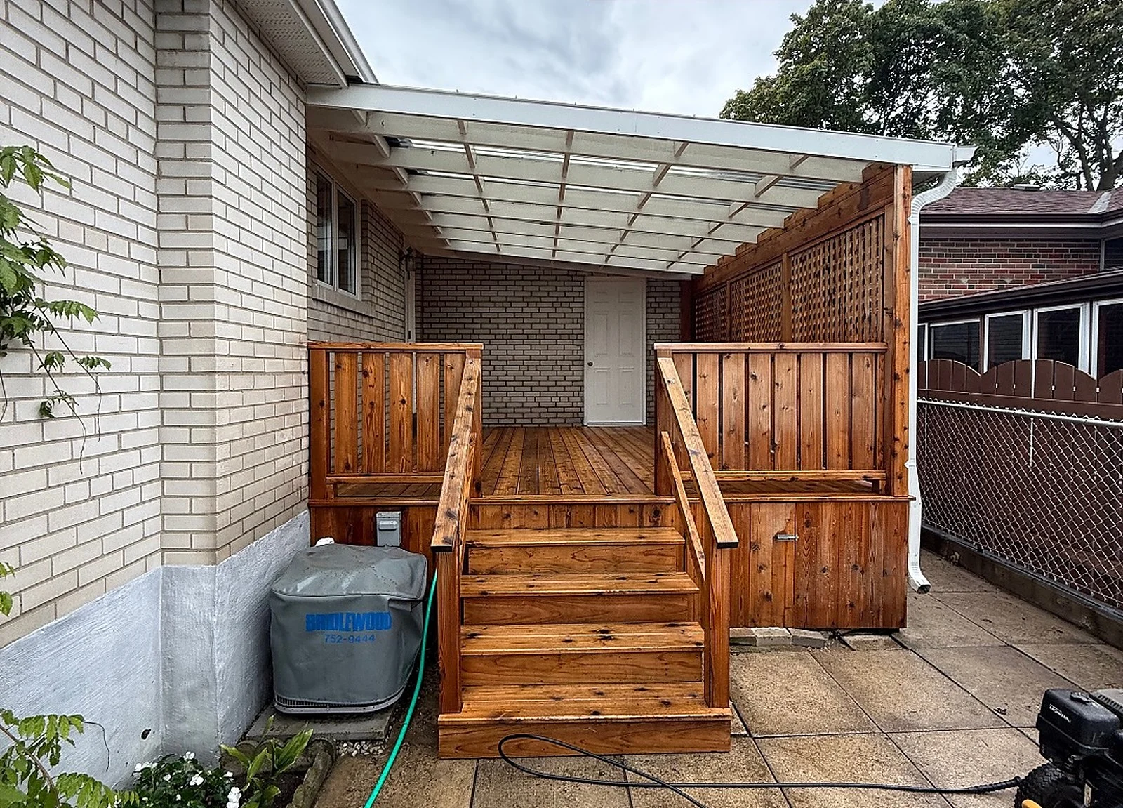 AFTER: rear cedar deck and stairs power-washed, warm orange cedar
