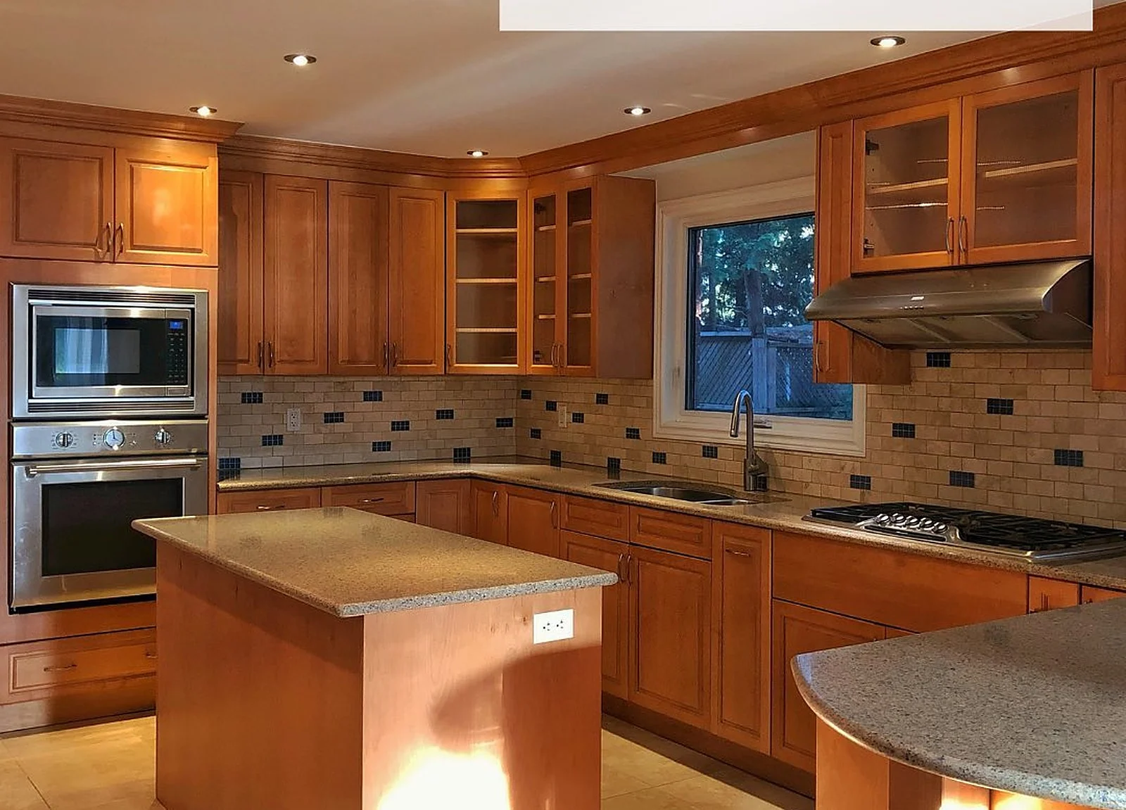 BEFORE: South Burlington kitchen with orange wood cabinets