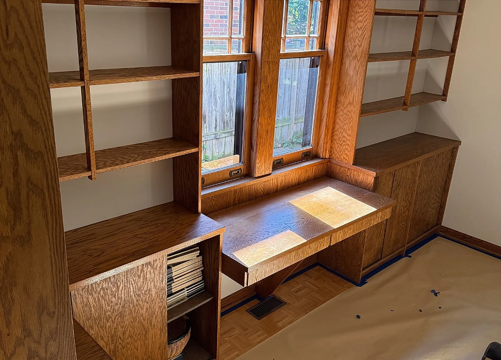 BEFORE: original stained oak built-ins and window seat