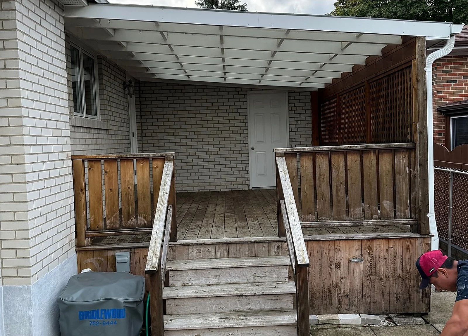 BEFORE: grey weathered cedar deck and stairs