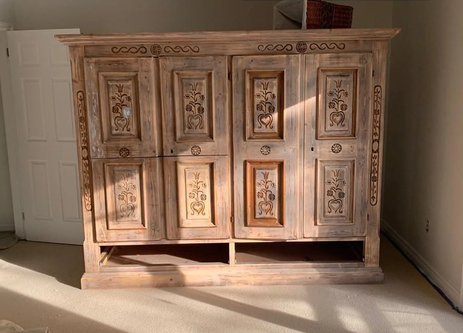 BEFORE: ornate natural wood armoire
