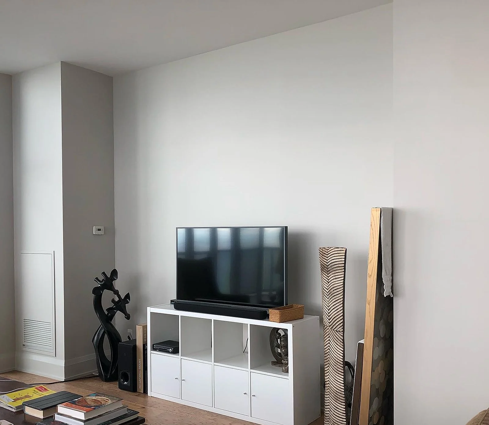 Penthouse living area white walls, TV unit