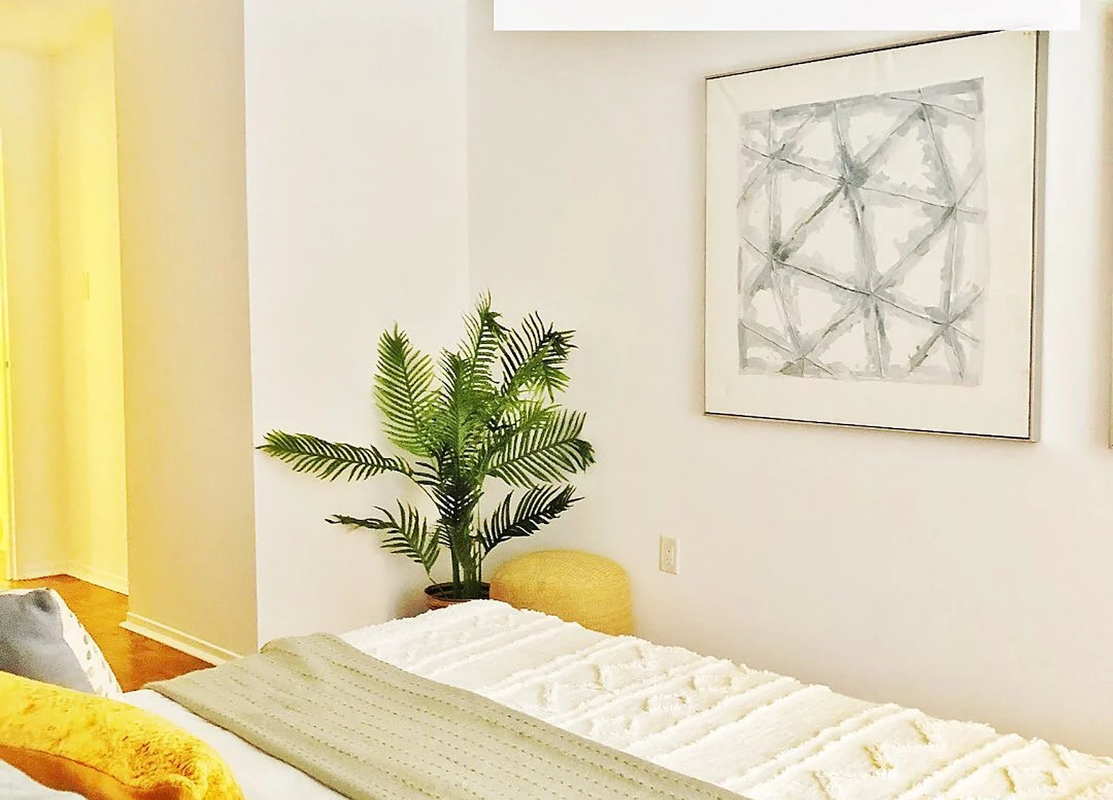 AFTER: bedroom white walls, staged bed