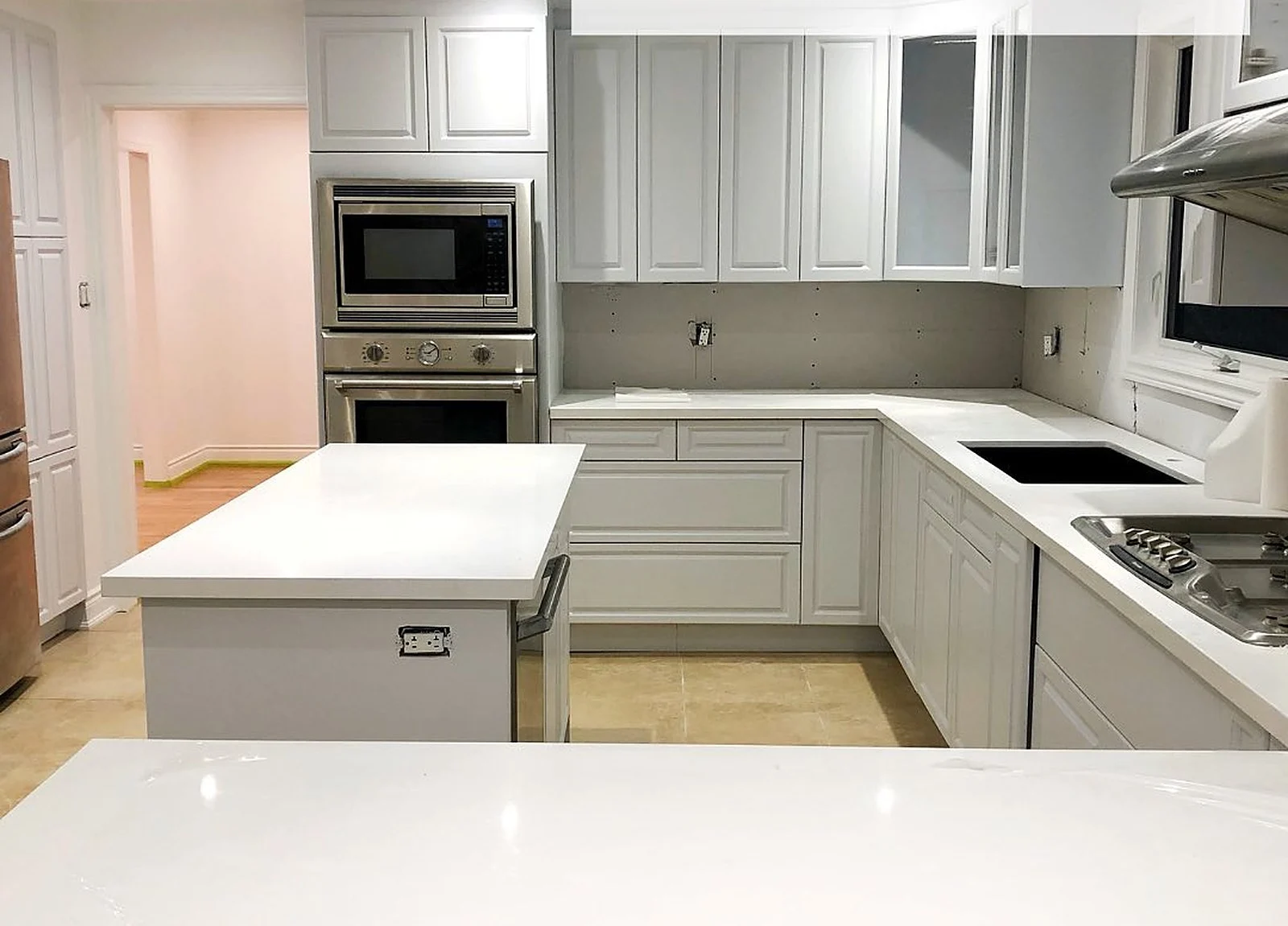 AFTER: kitchen painted light grey, angle 2