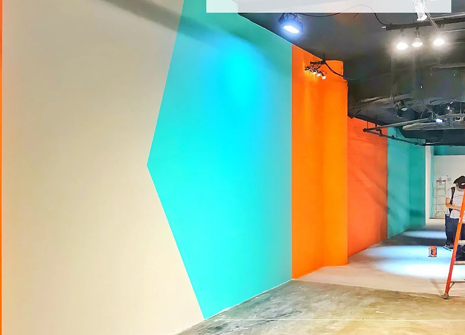 AFTER: Nike wall painted teal/orange colour-block graphic
