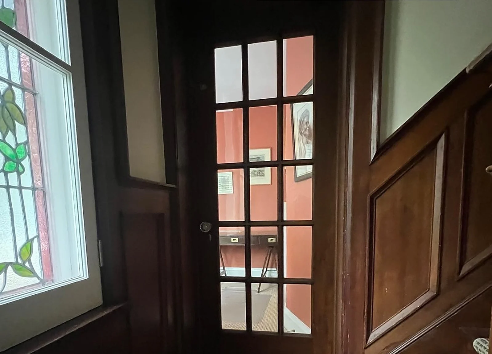 BEFORE: dark wood french door and wainscoting
