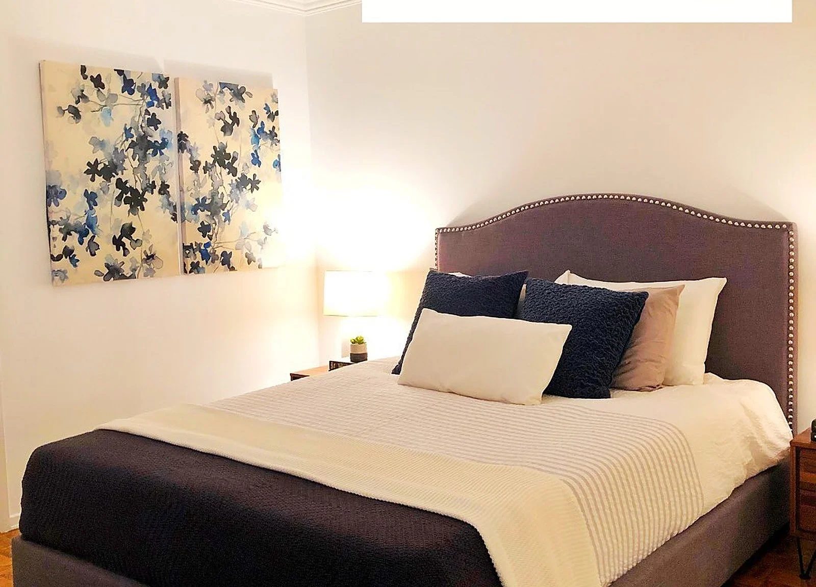 AFTER: staged bedroom, cream walls, floral art
