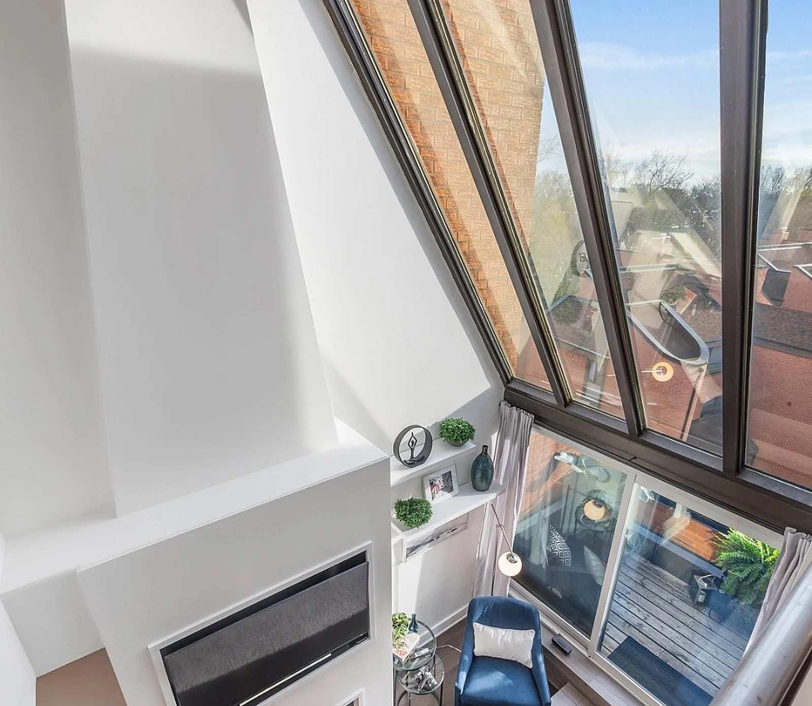 Penthouse sloped glass solarium wall