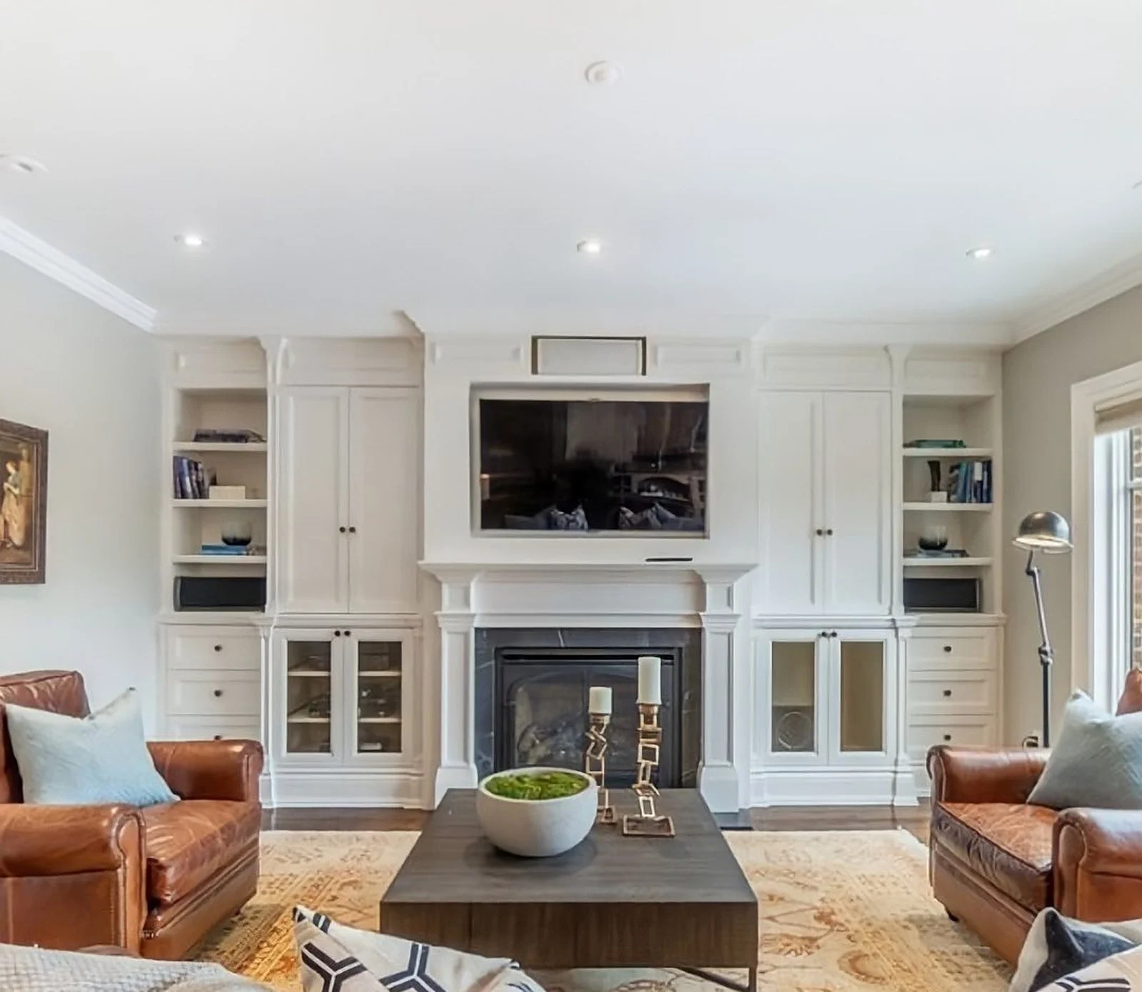Family room with white built-ins and fireplace