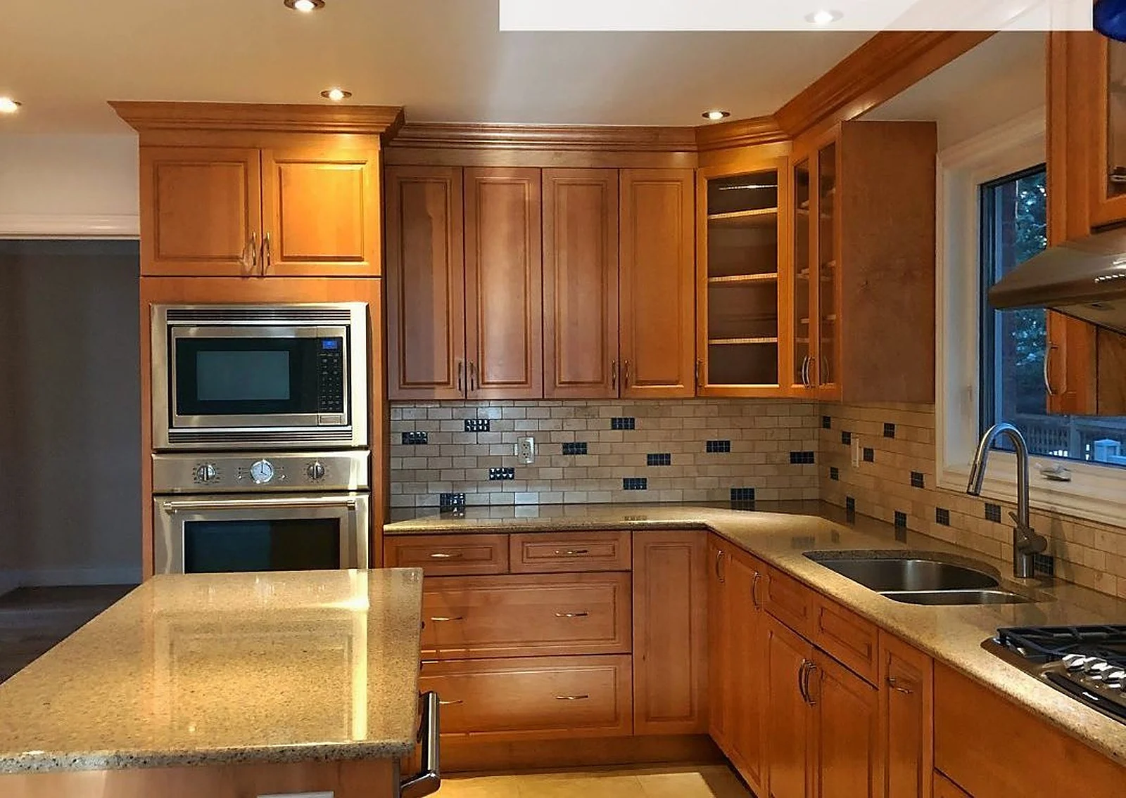 Before: Oak cabinets, sprayed white