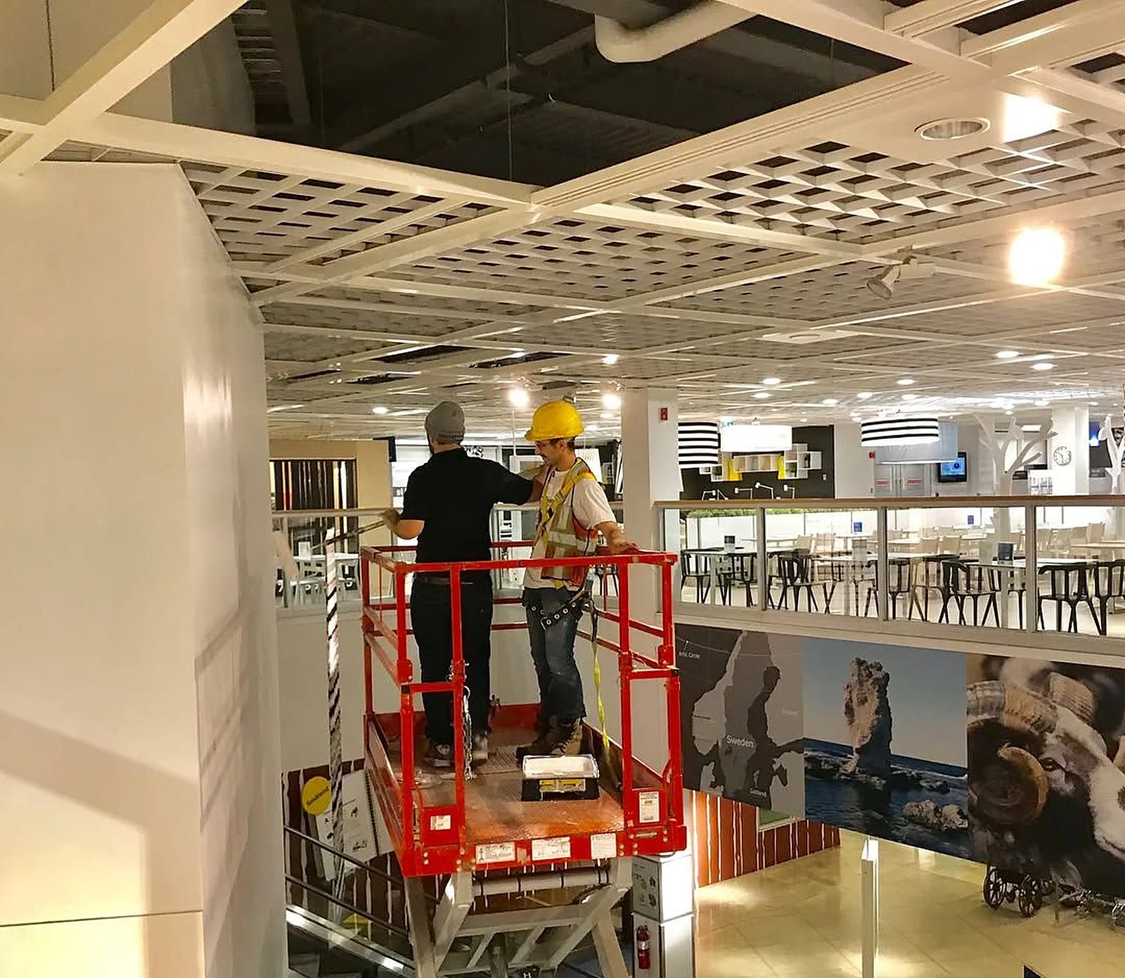 Crew painting from a scissor lift inside IKEA Vaughan