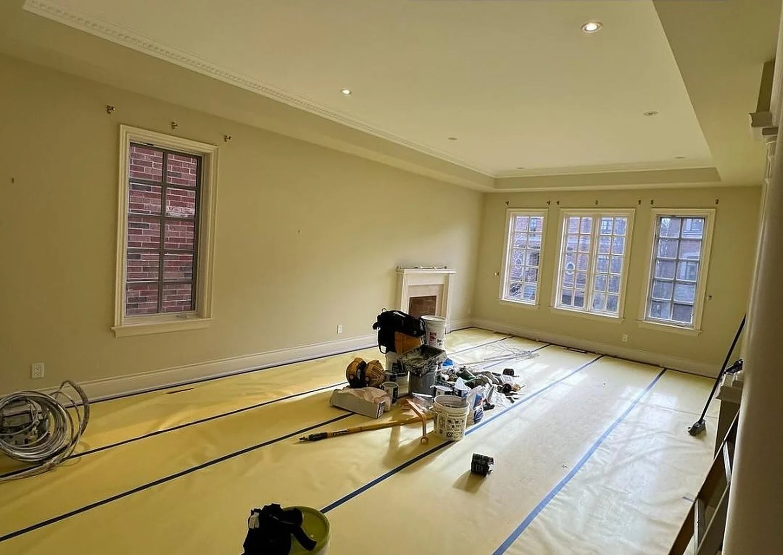 Before: Olive walls to a bright neutral, ready for listing photos
